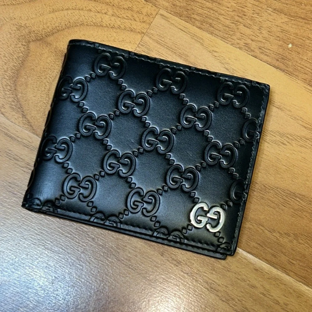Authentic Gucci Dorian Signature Embossed Leather Bifold Wallet